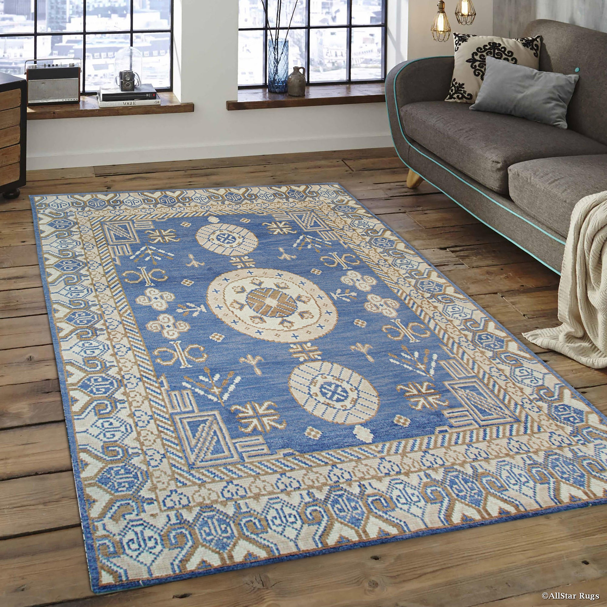 Handcrafted Traditional Blue Hand Knotted Wool Rug, deep blue and cream tones intertwine in an intricate traditional pattern, showcasing the rug's texture and detailed hand-knotted construction on a hardwood floor.