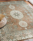 Trendy Traditional Brown Hand Knotted Wool Rug, its intricate patterns and warm brown tones softening a modern living room, showcasing exceptional craftsmanship.