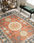 Jade Traditional Rust Hand Knotted Wool Rug, displaying rich rust hues and intricate traditional patterns, complementing a bright living space with neutral furniture.