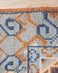 Jade Traditional Rust Hand Knotted Wool Rug, showcasing intricate traditional patterns in warm rust tones, hand-knotted wool construction lending texture and depth, seen in a styled room setting.
