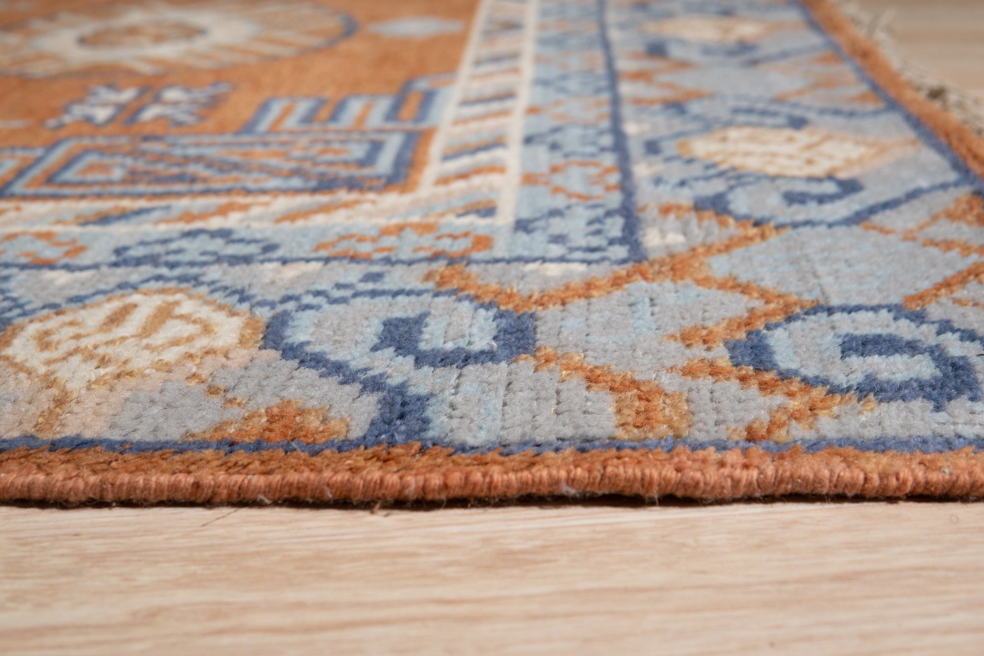 Jade Traditional Rust Hand Knotted Wool Rug, warm rust tones and intricate traditional patterns woven in hand-knotted wool, adding a touch of timeless elegance to a living room setting.