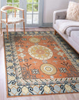 Jade Traditional Rust Hand Knotted Wool Rug, showcasing its intricate traditional patterns in warm rust hues. Hand-knotted wool construction offers a luxurious texture and lasting durability.