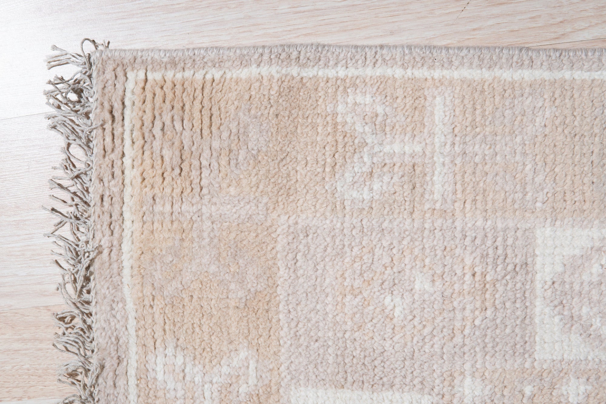 Classic Tessa Brown Hand Knotted Wool Rug, featuring intricate geometric patterns in warm brown tones, subtly textured and laid flat to showcase its detailed design.