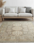 Classic Tessa Brown Hand Knotted Wool Rug, a warm brown wool rug with subtle texture, filling a light-filled living space with modern furniture.