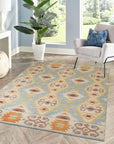 Freya Traditional Blue Hand Knotted Wool Rug, its intricate patterns unfolding in shades of blue and cream, resting elegantly on a light hardwood floor, suggesting warmth and timeless style.