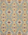 Isolated view of Freya Traditional Blue Hand Knotted Wool Rug, showcasing its intricate floral and geometric design with vibrant blues, creams, and touches of rust.