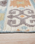 Freya Traditional Blue Hand Knotted Wool Rug, intricate patterns dance across a blue wool field, hand-knotted texture inviting touch, as seen in a lifestyle setting.