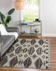 Chic Kilim Ivory Flatweave Rug, showcasing a cozy living room setting with a light wood coffee table, neutral sofa, and this ivory flatweave rug anchoring the space with its subtle geometric pattern.