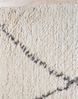 Jade Trellis Beige Hand Knotted Wool Rug, showing a detailed view of its intricate trellis pattern and plush wool texture, illuminating the rug's hand-knotted construction and soft beige hues.