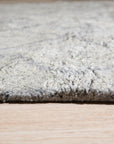 Captivating Moroccan Gray Hand Knotted Wool Rug, a gray wool rug with a classic Moroccan design, seen in a bright, modern living room setting.