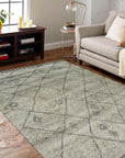 Captivating Moroccan Gray Hand Knotted Wool Rug, its plush pile and intricate geometric patterns visible within a bright, airy living space.