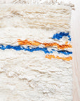 Delicate Moroccan Beige Hand Knotted Wool Rug, a warm beige wool rug with a traditional Moroccan design, seen in a room setting with complementary furniture.