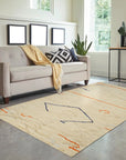 Delicate Moroccan Beige Hand Knotted Wool Rug, its intricate geometric patterns and soft beige tones complementing a minimalist living room with warm wood floors and natural light, illustrating the rug's scale and texture in situ.