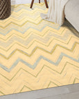 Charming Nadia Ivory Hand Tufted Wool Rug, a plush ivory wool rug with subtle geometric patterns, displayed in a bright, modern living room setting.