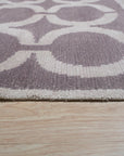 Opulent Kira Brown Hand Knotted Wool & Bamboo Silk Rug, featuring rich browns and subtle sheen, lies flat on a light floor, its intricate pattern adding warmth and texture to the room.