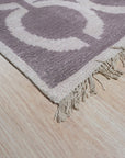 Opulent Kira Brown Hand Knotted Wool & Bamboo Silk Rug, showcasing its intricate pattern in warm browns and shimmering silk accents; luxurious texture and hand-knotted construction evident.