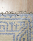 Louie Para Blue Hand Knotted Wool & Bamboo Silk Rug, a captivating blend of cool blues and shimmering silk highlights, laid elegantly on a polished floor, inviting warmth and sophistication into the space.