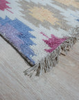Sumptuous Majestic Multicolor Hand Knotted Wool & Bamboo Silk Rug, bursts with vibrant hues in a complex pattern of interwoven colors, its plush texture hinting at luxurious softness.