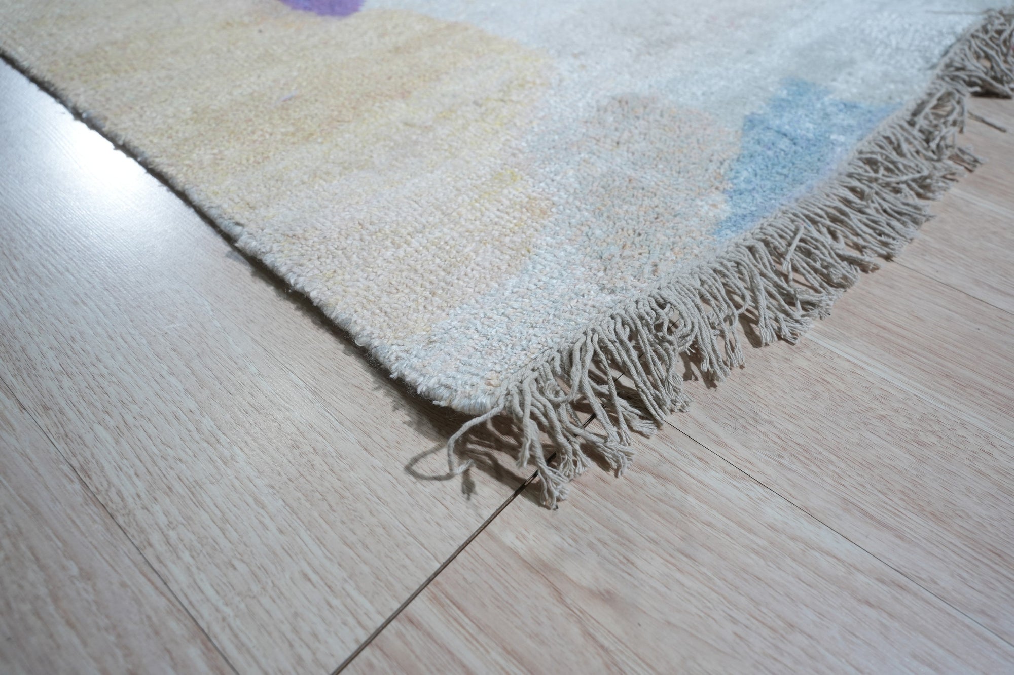 Fiona Trara Multicolor Handmade Bamboo Silk Rug, vibrant hues dance across the lustrous bamboo silk pile, hand-knotted artistry radiating warmth and sophistication in a styled room setting.