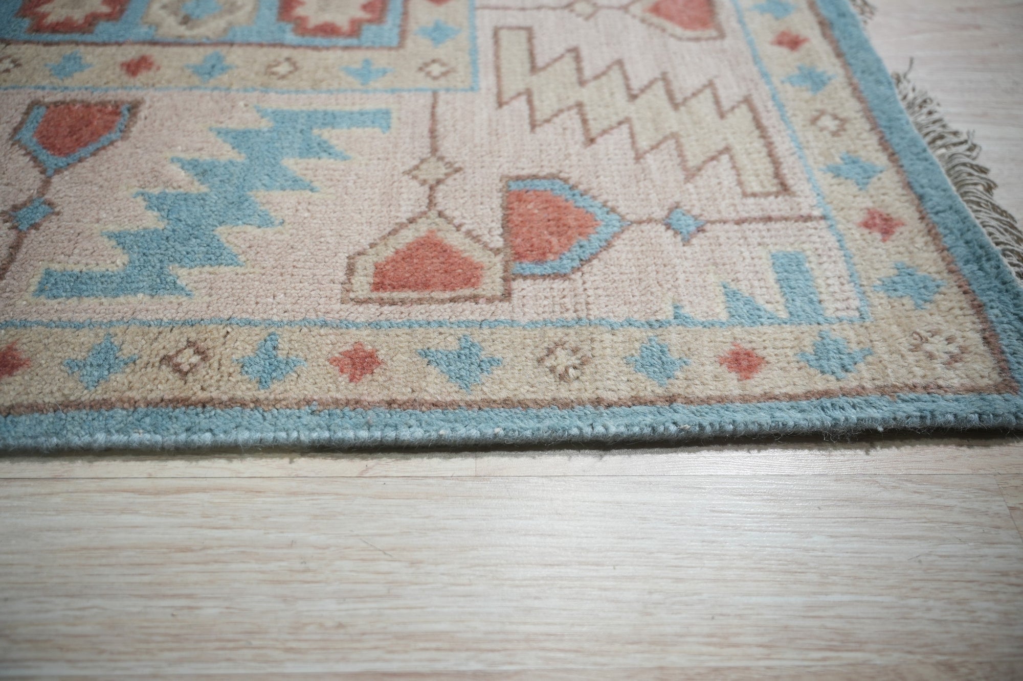 Given the image position is 4, here's the alt text:
 
 Yara Willow Light Blue Hand Knotted Wool Rug in a living room setting, subtly textured light blue tones grounding the space.