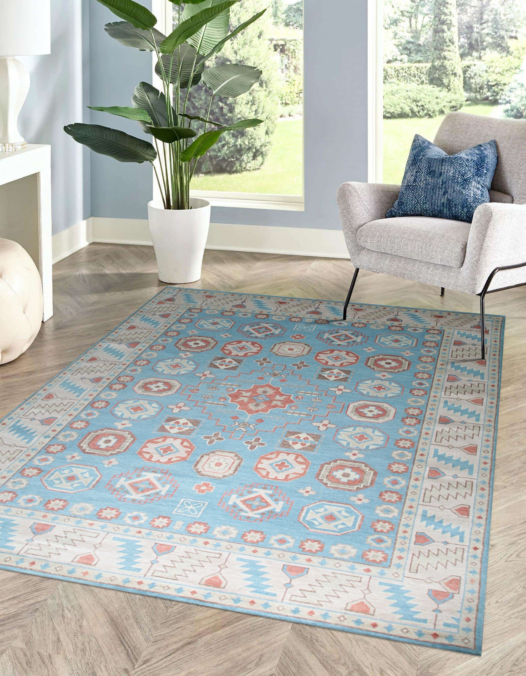 Yara Willow Light Blue Hand Knotted Wool Rug graces a warmly lit living room, its delicate willow pattern unfolding across the soft, light blue wool fibers, anchoring a seating area with understated elegance.