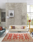 Penelope Traditional Rust Hand Knotted Wool Rug displayed in a warmly lit living room setting. Hand-knotted construction evident in the close-up view, revealing intricate patterns and rich rust hues of the wool fibers.