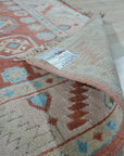 Penelope Traditional Rust Hand Knotted Wool Rug, displaying intricate rust-toned patterns across a hand-knotted wool surface, adding warmth and traditional elegance to a room.
