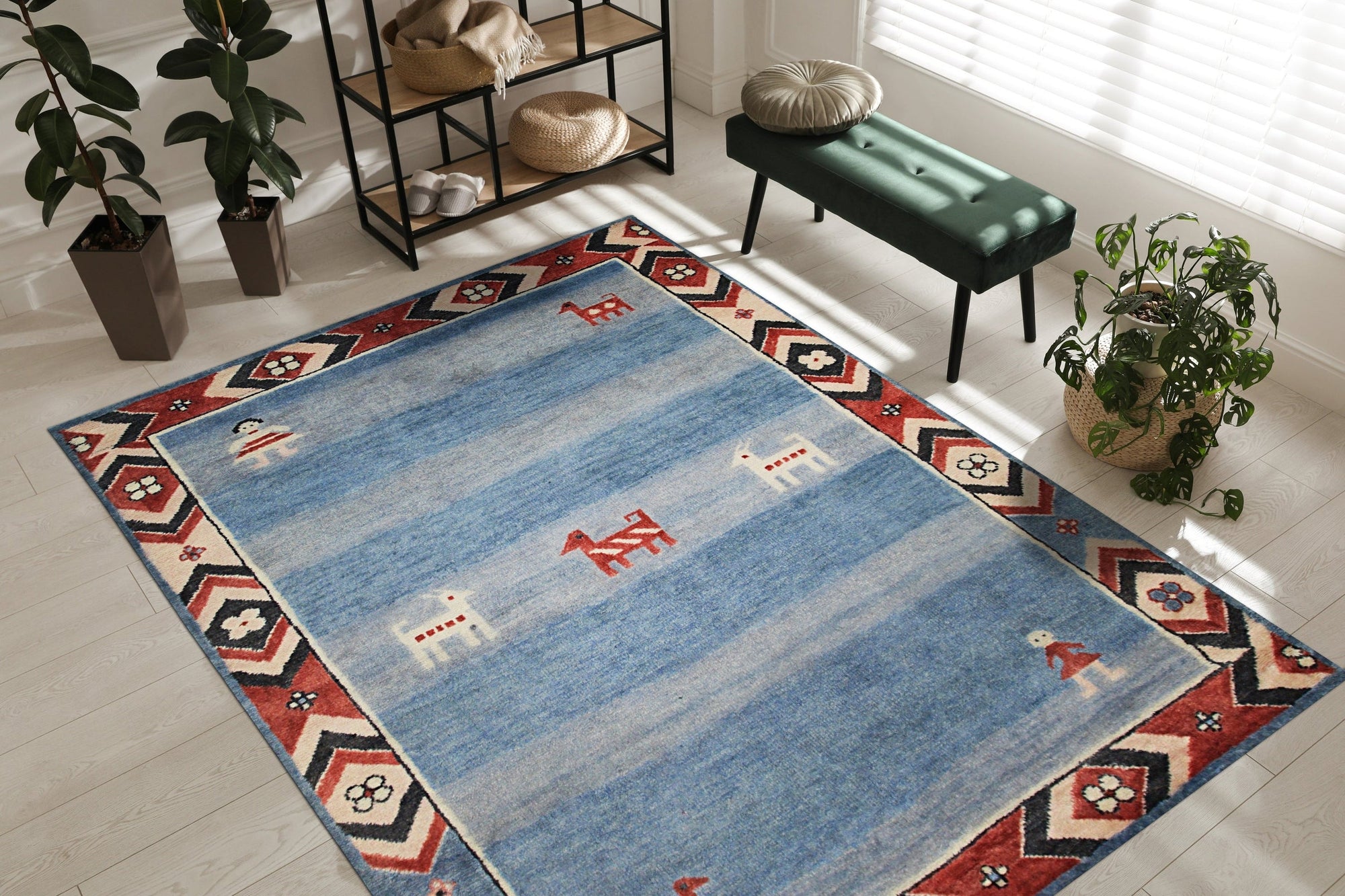 Willow Talia Blue Hand Knotted Wool Rug, a textured blue wool rug with a subtle, distressed pattern, lays flat on a light wood floor, inviting warmth and understated elegance into the room.