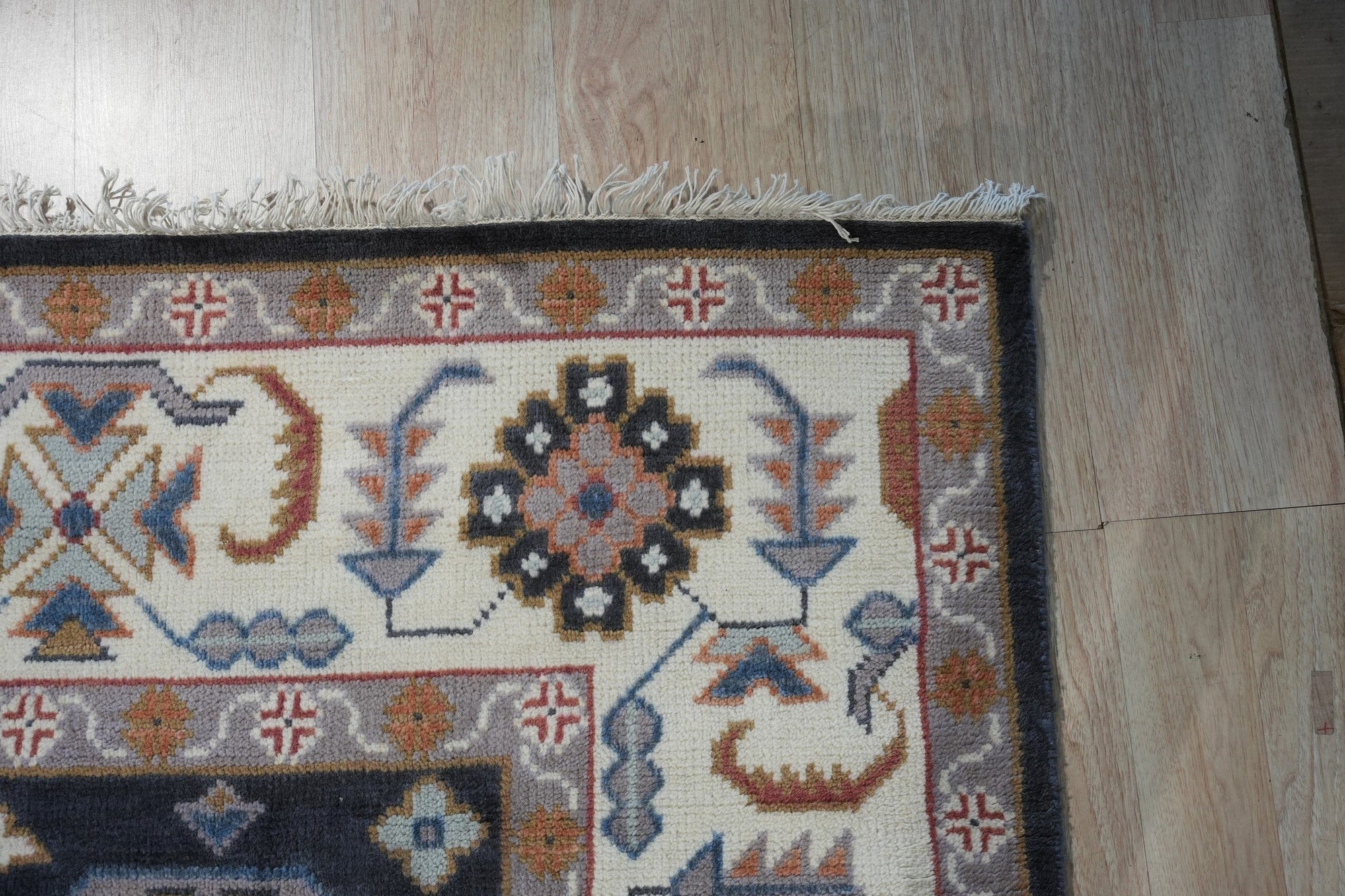 Refined Oushak Charcoal Hand Knotted Wool Rug, charcoal wool rug with a traditional Oushak design, seen in a bright, neutral living room setting.