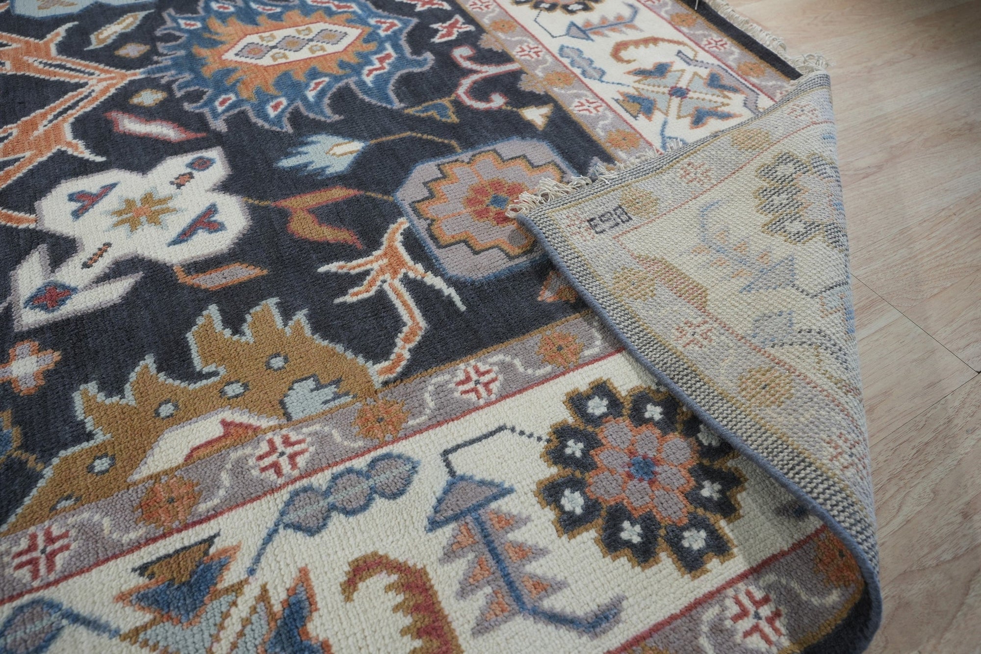 Refined Oushak Charcoal Hand Knotted Wool Rug, charcoal wool rug displaying intricate Oushak patterns, presented in a styled room setting.