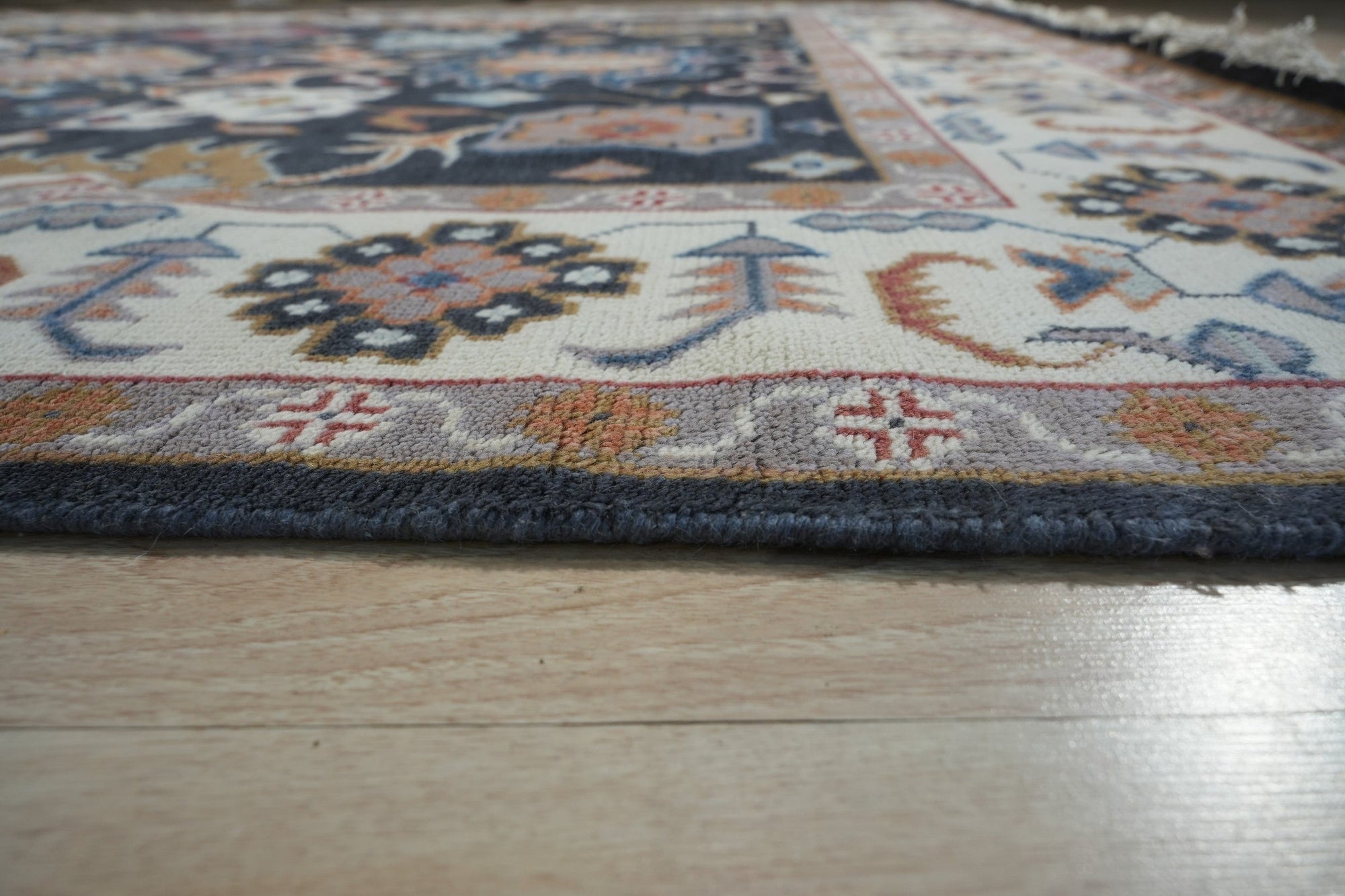 Refined Oushak Charcoal Hand Knotted Wool Rug, featuring intricate knotwork and subtle tonal variations in deep charcoal, subtly textured and inviting.