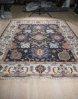 Refined Oushak Charcoal Hand Knotted Wool Rug, its charcoal hues and hand-knotted wool construction displayed in a staged living room setting.