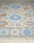 Enchanting Traditional Beige Hand Knotted Wool Rug, showcasing intricate, traditional patterns in beige wool, laid on a hardwood floor, hinting at a cozy, inviting room.