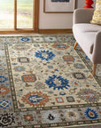 Enchanting Traditional Beige Hand Knotted Wool Rug, warm beige tones and intricate traditional patterns define this hand-knotted wool rug, softening a well-lit space.