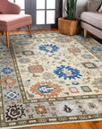 Enchanting Traditional Beige Hand Knotted Wool Rug, a beige wool rug with an intricate traditional design, seen elegantly displayed in a well-lit room.