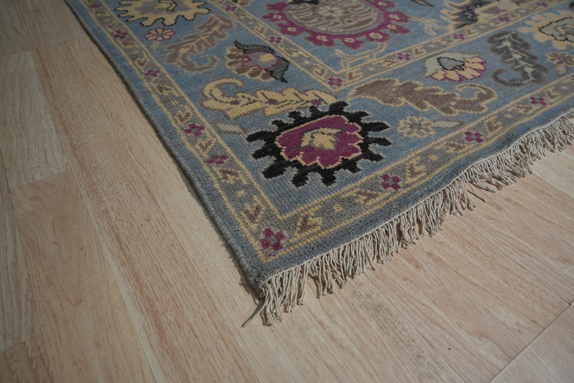 Tessa Laine Blue Hand Knotted Wool Rug, soft blue hues and intricate patterns meeting in a hand-knotted wool rug, adding warmth and sophistication to a modern living space.