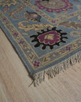 Tessa Laine Blue Hand Knotted Wool Rug, soft blue hues and intricate patterns meeting in a hand-knotted wool rug, adding warmth and sophistication to a modern living space.
