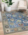 Nina Penelope Blue Nan Rug displayed in a brightly lit room. The blue rug features a subtle, geometric nan pattern, adding a touch of modern texture to the space.