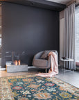 Sarrah Oushak Charcoal Hand Knotted Wool Rug, showcasing a soft charcoal palette and intricate Oushak design, lies elegantly in a well-lit living room.