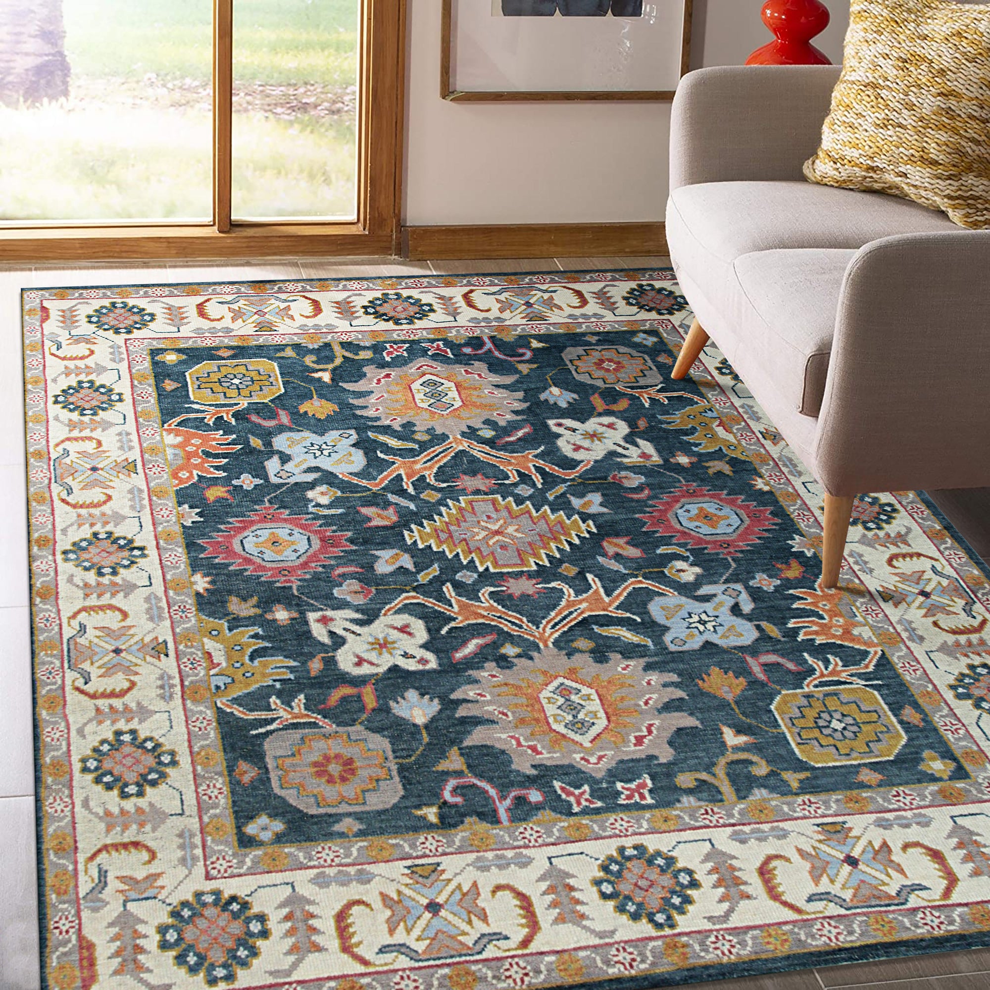 Sarrah Oushak Charcoal Hand Knotted Wool Rug, muted charcoal tones and intricate floral patterns unfolding across hand-knotted wool, enriching a softly lit living space.