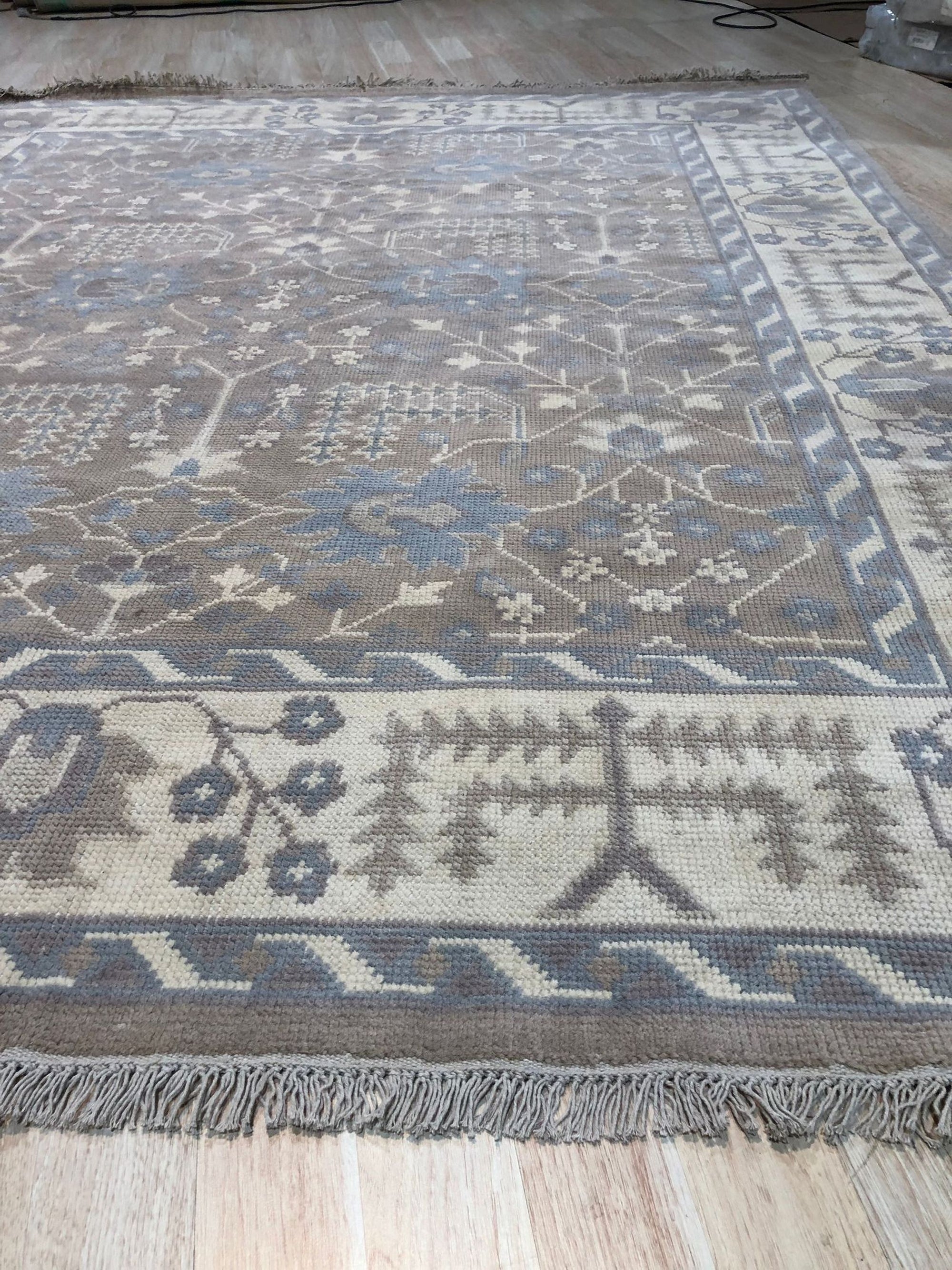 Lydia Sophisticated Brown Hand Knotted Wool Rug, warm browns and subtle patterns create a sophisticated, hand-knotted texture underfoot, adding elegance to a living space.