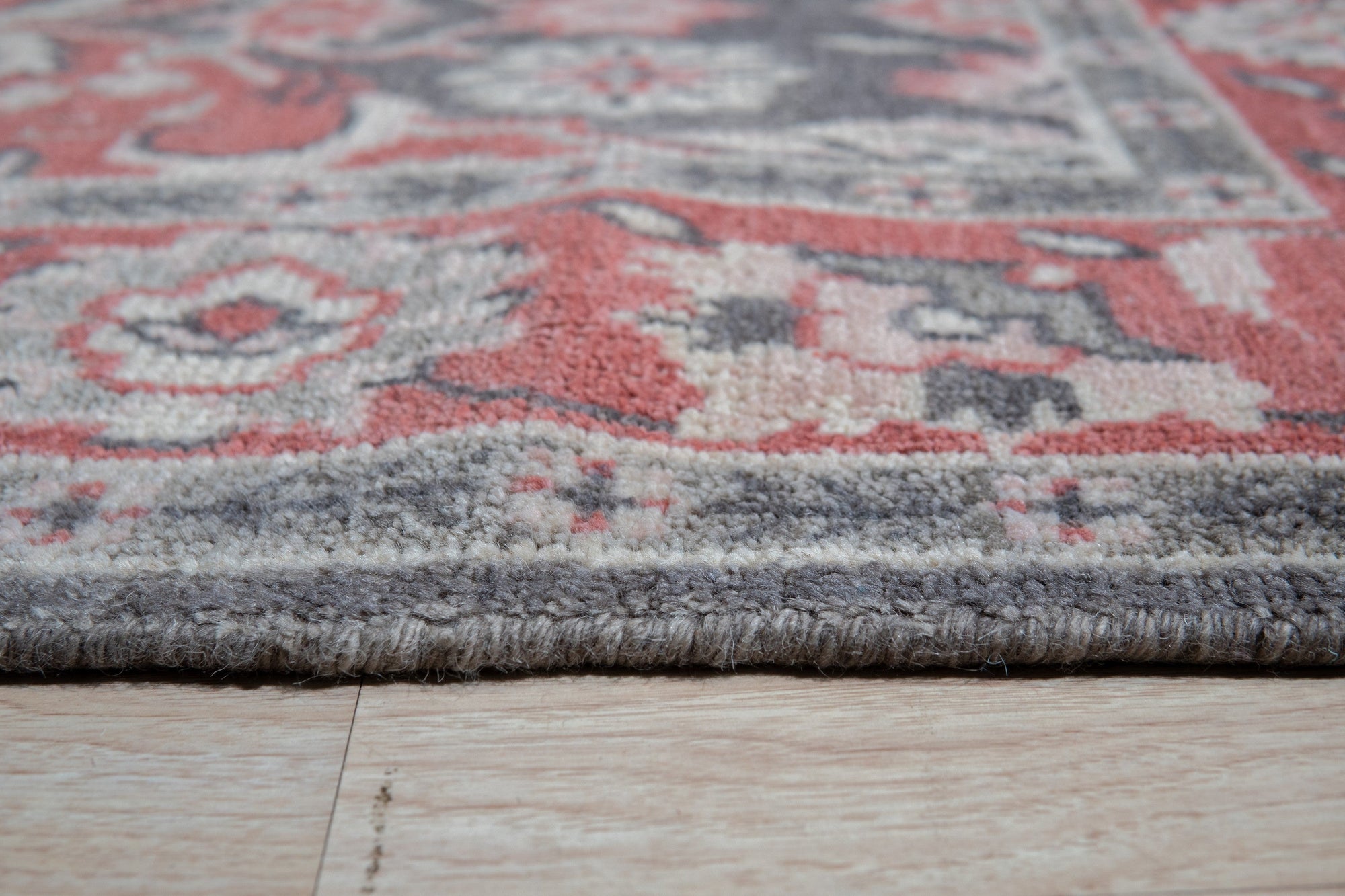 Majestic Classic Rust Hand Knotted Wool Rug, a warm rust-toned wool rug with intricate traditional patterns, filling a bright living room space.