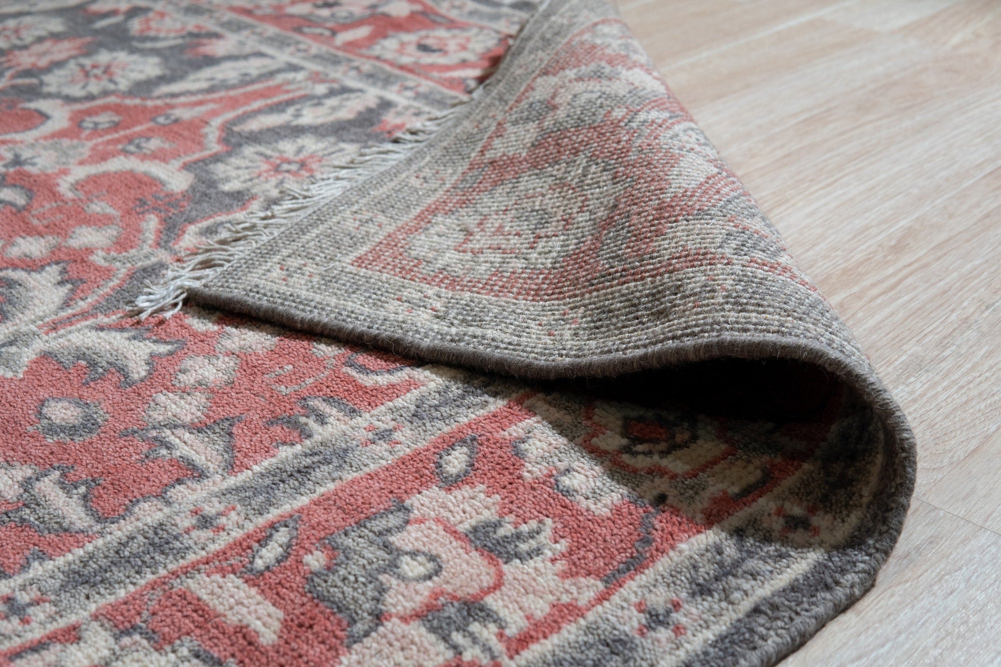Majestic Classic Rust Hand Knotted Wool Rug, rich rust tones and intricate hand-knotted details create a warm, inviting texture, seen in a lifestyle setting showcasing its elegance.