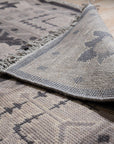 Cozy Oushak Charcoal Hand Knotted Wool Rug, a charcoal wool rug with a classic Oushak design, seen in a bright, airy living space with modern furniture.