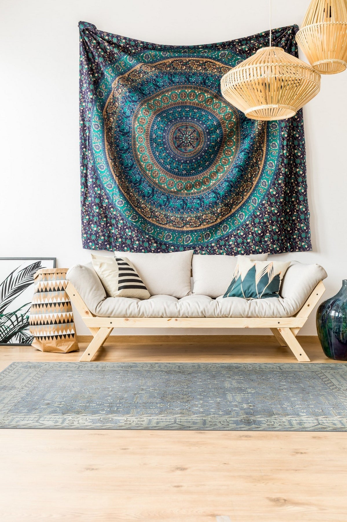 Harlow Traditional Gray Hand Knotted Wool Rug, featuring intricate patterns in shades of gray and cream, lies gracefully on a light wood floor, enhancing the room's inviting atmosphere.