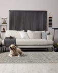 Selene Oushak Rust Hand Knotted Wool Rug, its intricate floral pattern in warm rust tones grounding a comfortably furnished living space.