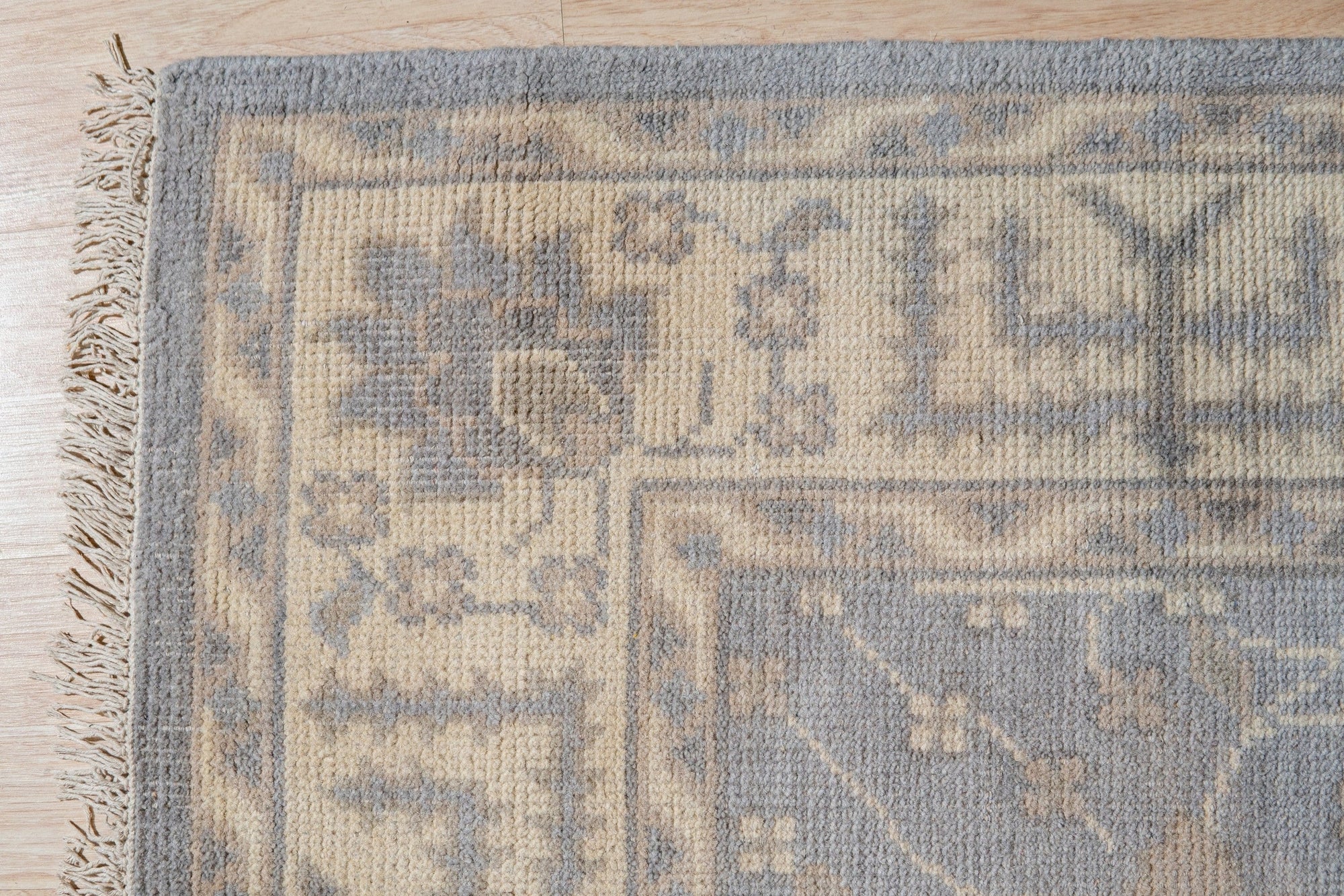 Selene Oushak Rust Hand Knotted Wool Rug, vibrant rust hues and intricate Oushak patterns unfold in a warm, inviting living space. Hand-knotted wool texture adds depth and comfort.