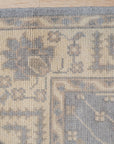 Selene Oushak Rust Hand Knotted Wool Rug, vibrant rust hues and intricate Oushak patterns unfold in a warm, inviting living space. Hand-knotted wool texture adds depth and comfort.