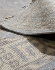 Selene Oushak Rust Hand Knotted Wool Rug, a rust-toned wool rug featuring a traditional Oushak design with floral and geometric motifs, adding warmth and texture to a well-lit room.
