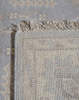 Selene Oushak Rust Hand Knotted Wool Rug, a rust-toned wool rug featuring a traditional Oushak design with intricate floral motifs and a subtly distressed texture, displayed in a bright interior setting.